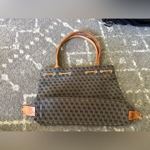 Dooney & Bourke, Inc bag. 
Needs a lot of love